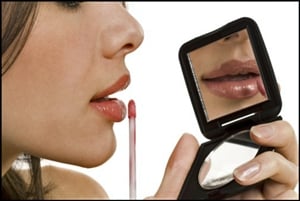 Lip gloss may help your lips look more full and youthful