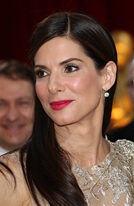 Sandra Bullock chose a big hat over makeup during a recent outing. 