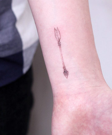 Tiny, Hyperrealistic Arrow Tattoo